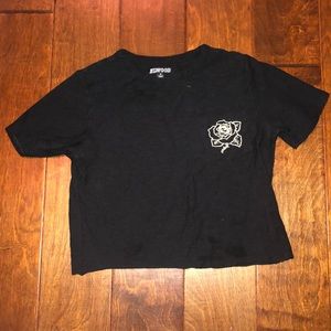 black t-shirt with a rose on it